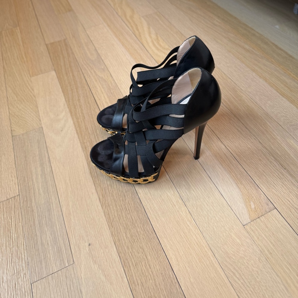 Casadei black leather heels with elastic straps.